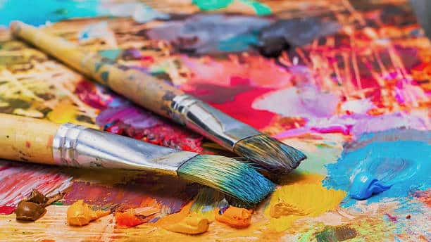 Painting with paint and paint brushes.