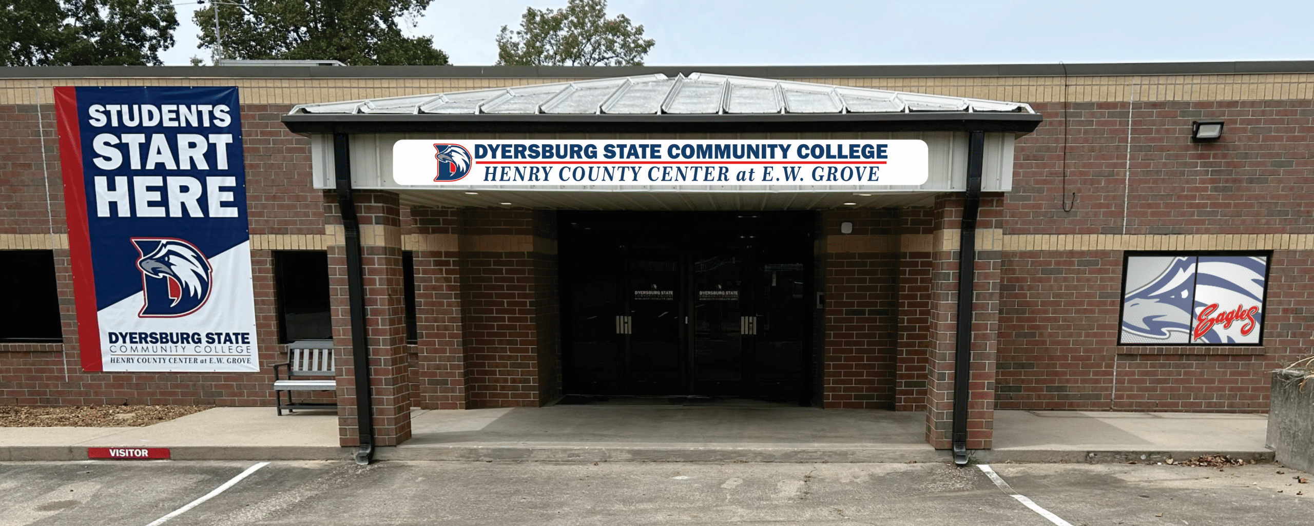 Henry County Center at E.W. Grove building. Brick building with canopy over glass doors. Dyersburg State logo over the top of the canopy with a banner on the wall saying, 