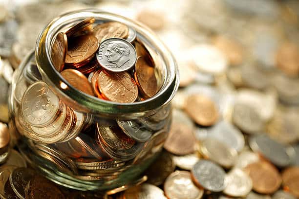 Image of a jar holding money as a symbol for fundraising.