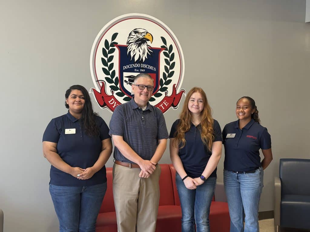 Dr. Scott Cook with Officers Morgan Gilley (President), Destiny Smith (Vice President, JNC) and Kennedi Robinson (Senator).